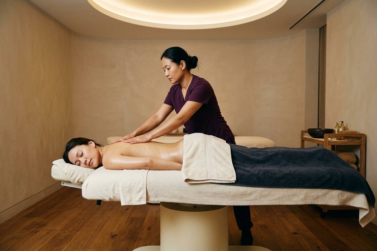 Long sweeping strokes along the back during a full body massage